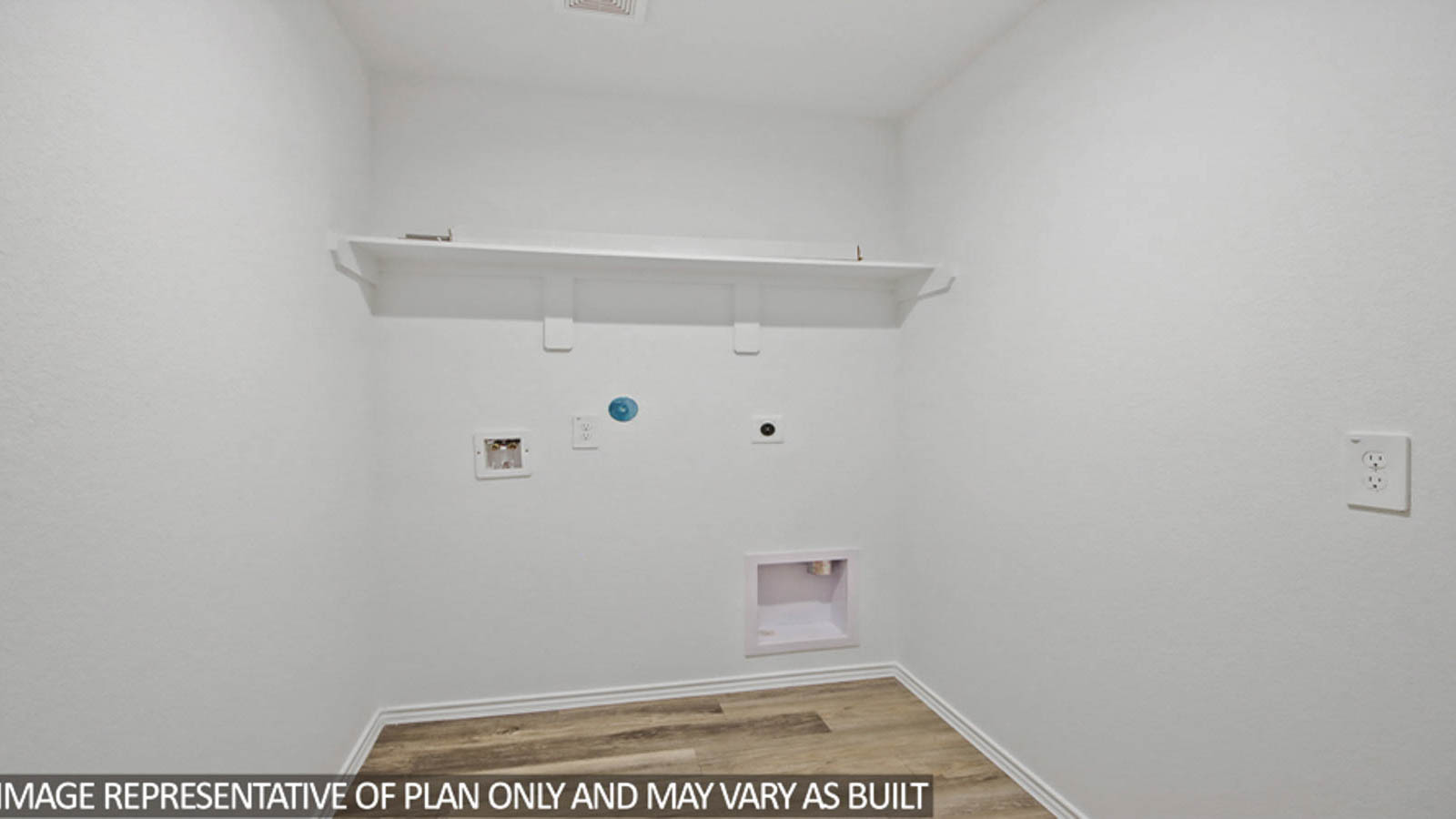 Utility room with vinyl flooring and overhead storage space.