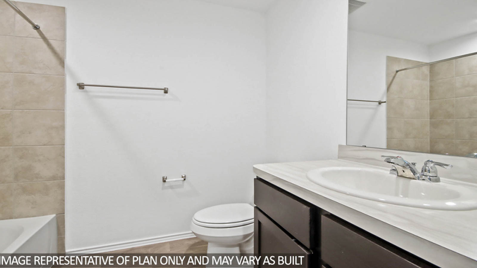 Secondary bathroom with a tile tub/shower combo.