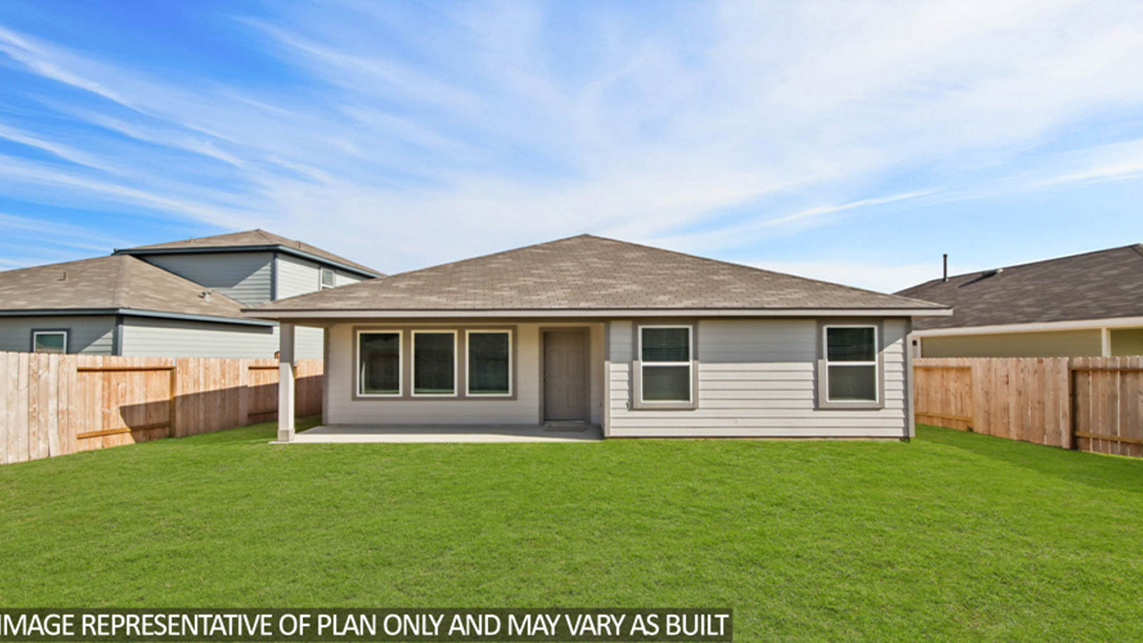 Spacious backyard with patio.