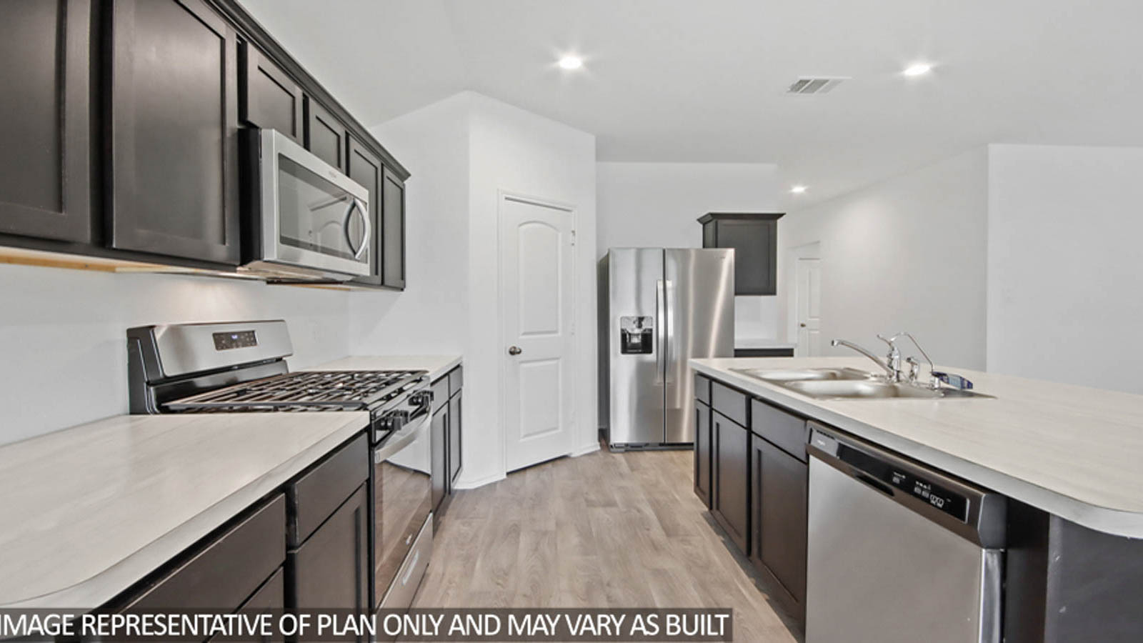 Kitchen with island and stainless-steel appliances.