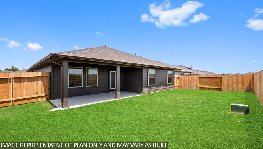 Spacious backyard with patio.