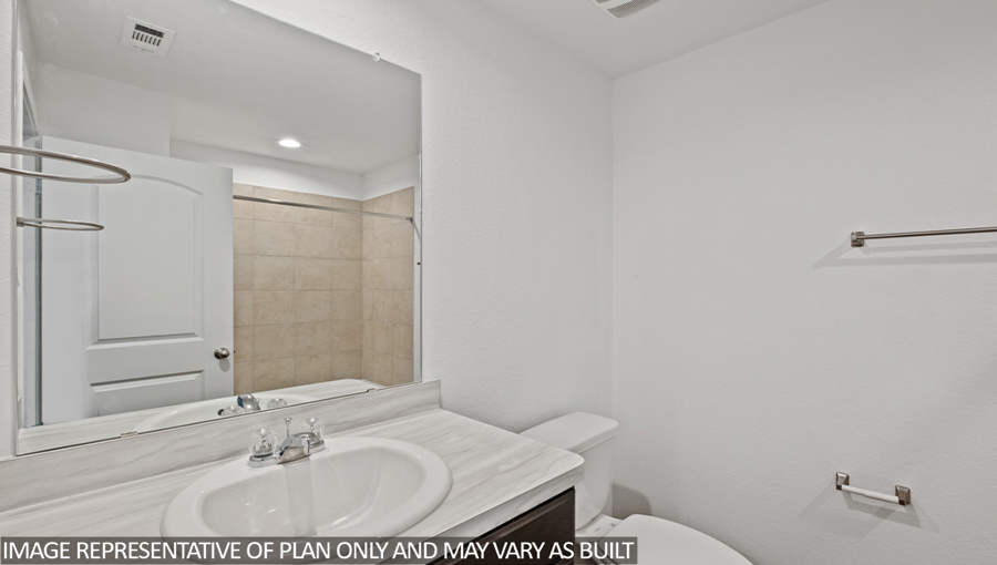 Secondary bathroom with a tile tub/shower combo.