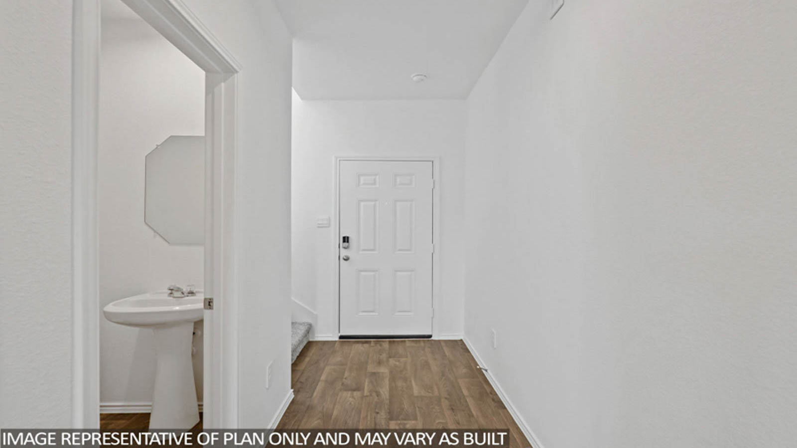 Entryway and foyer with vinyl flooring.