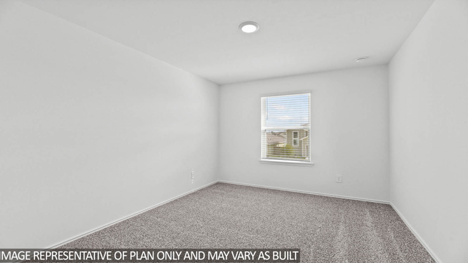 Secondary bedroom with carpet flooring and bright window.