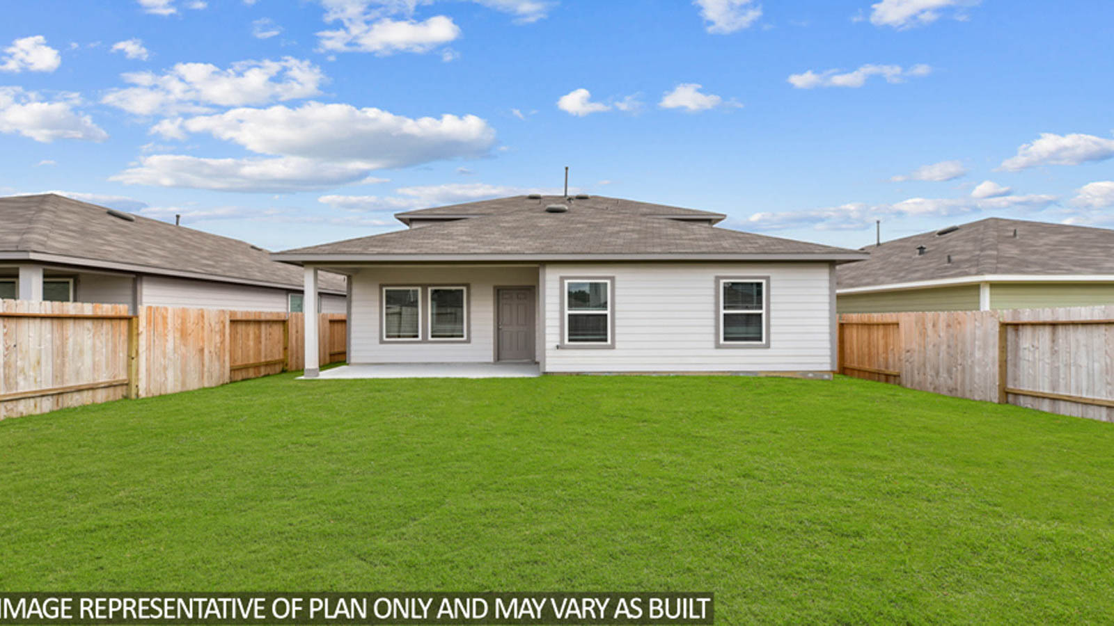 Spacious backyard with patio.