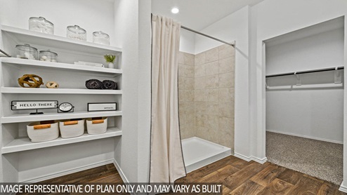 Big standing shower and shelves for storage,