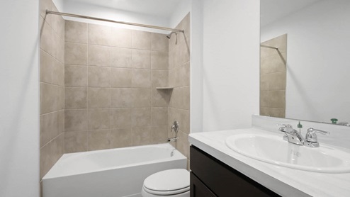Secondary bathroom with large sink and tub/shower combo.