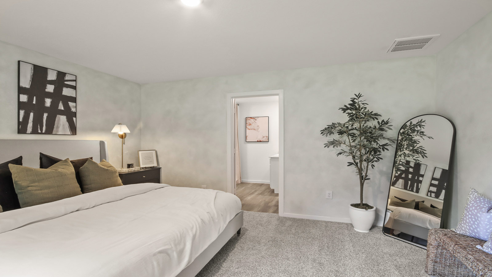 Primary bedroom with carpet flooring