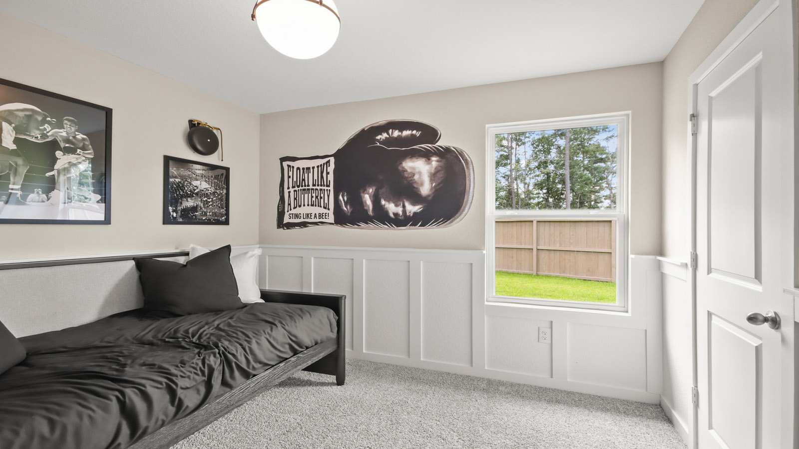 Secondary bedroom with carpet flooring