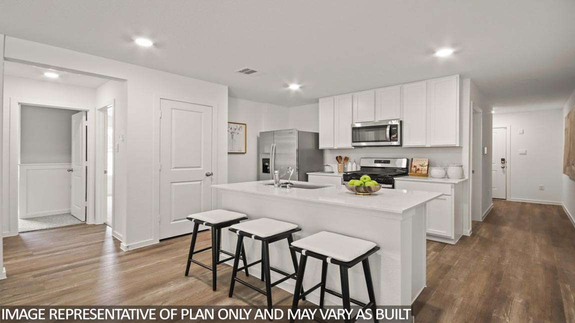 Kitchen with an island and stainless-steel appliances.