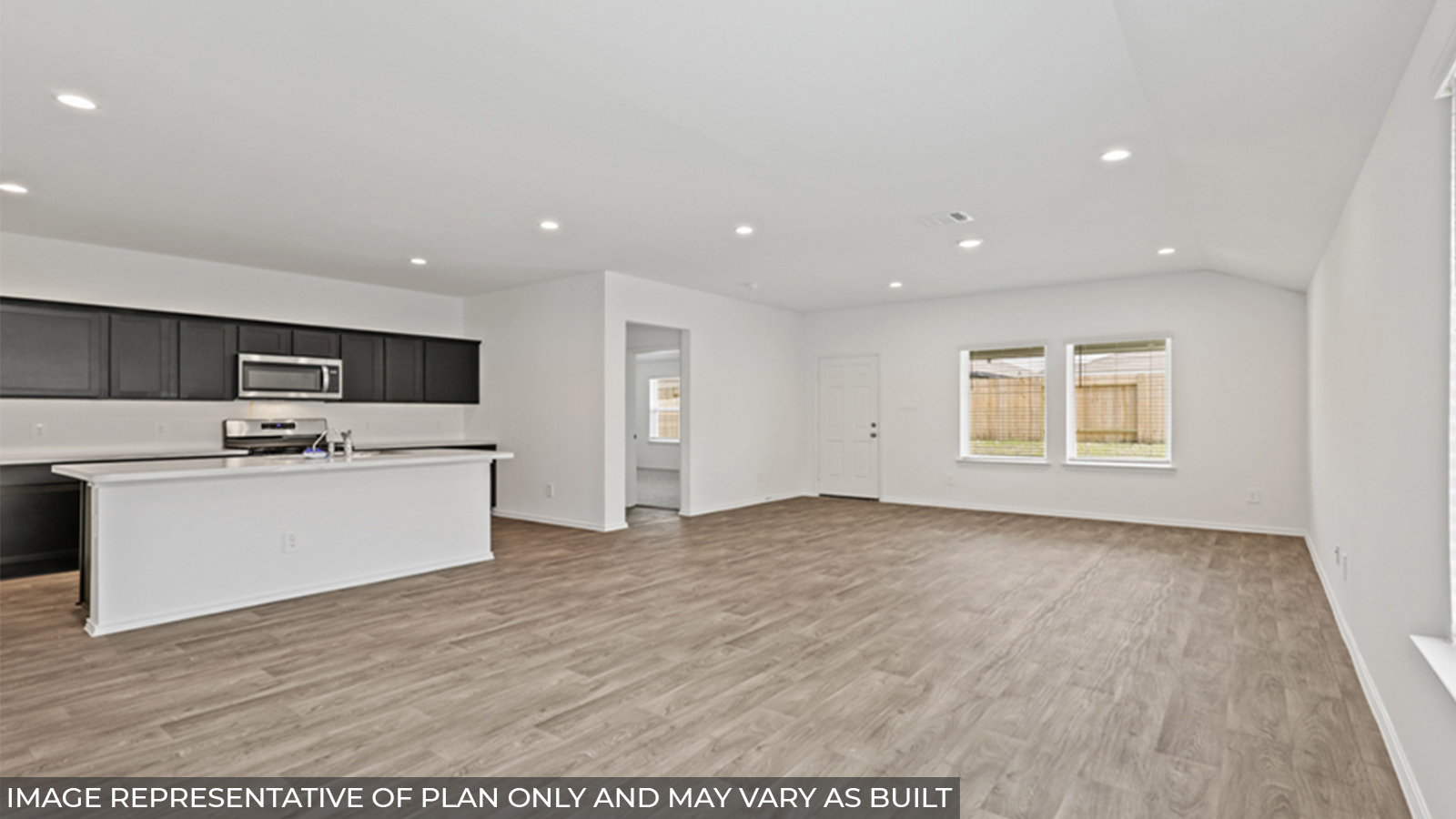 Open concept living, dining, and kitchen area