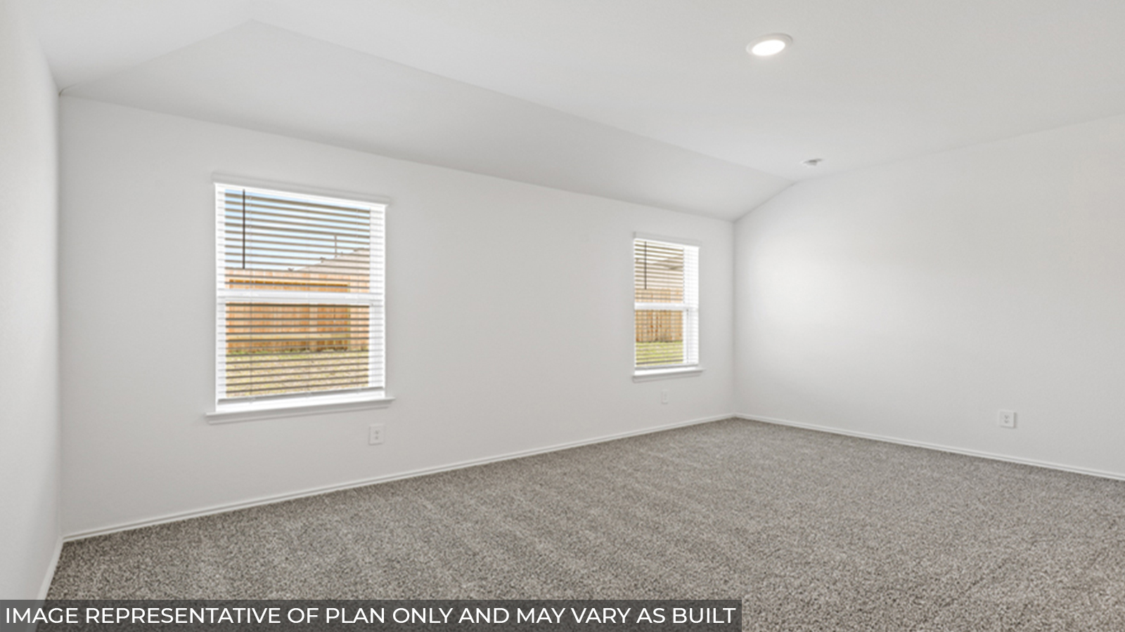 Primary bedroom with carpet flooring