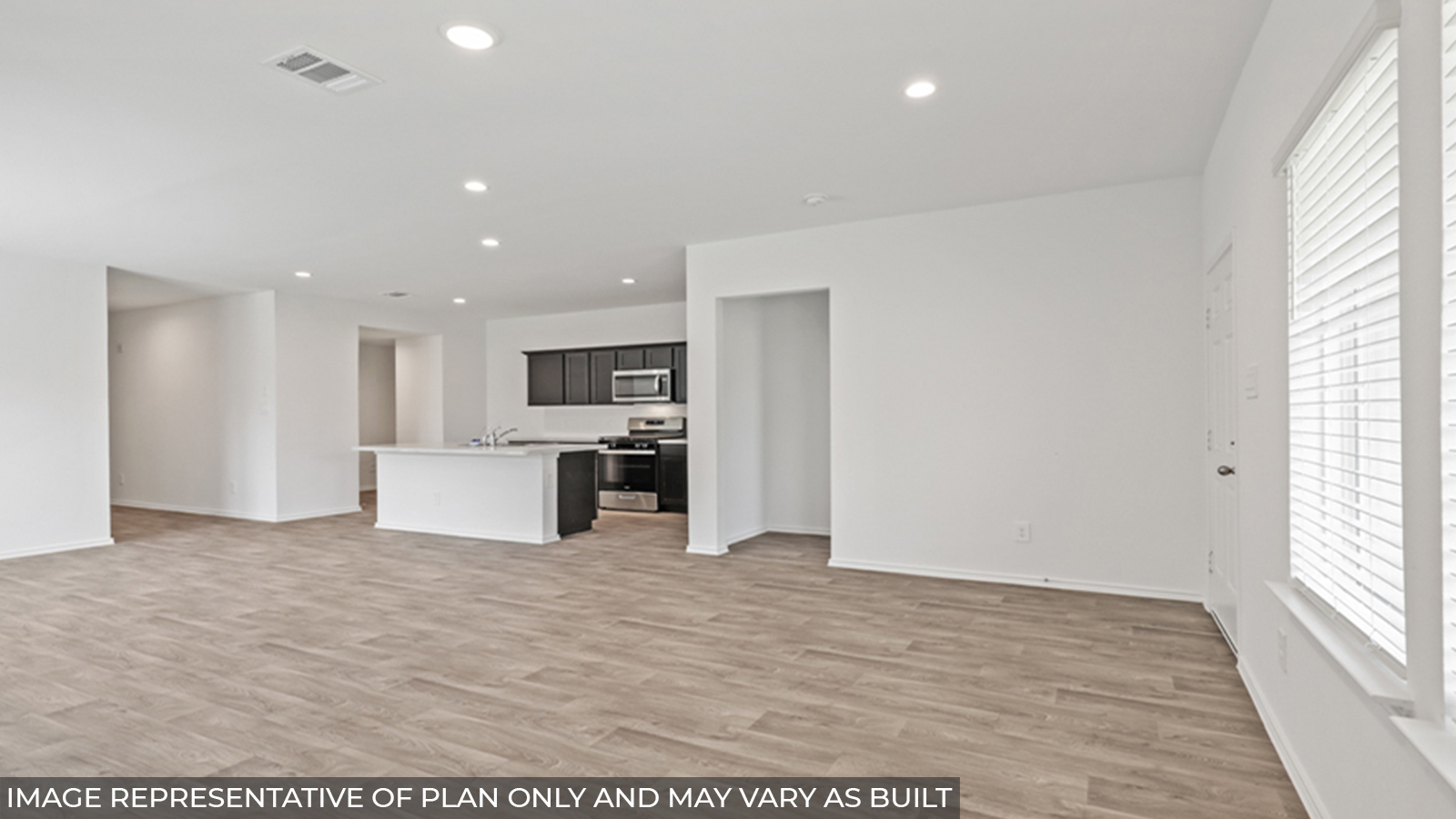 Open concept living, dining, and kitchen area