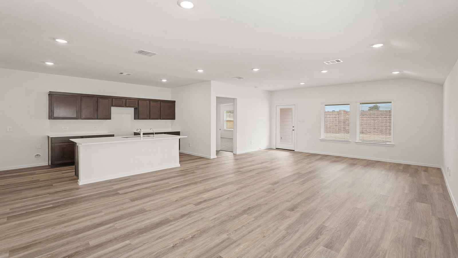 Open concept living, dining, and kitchen area