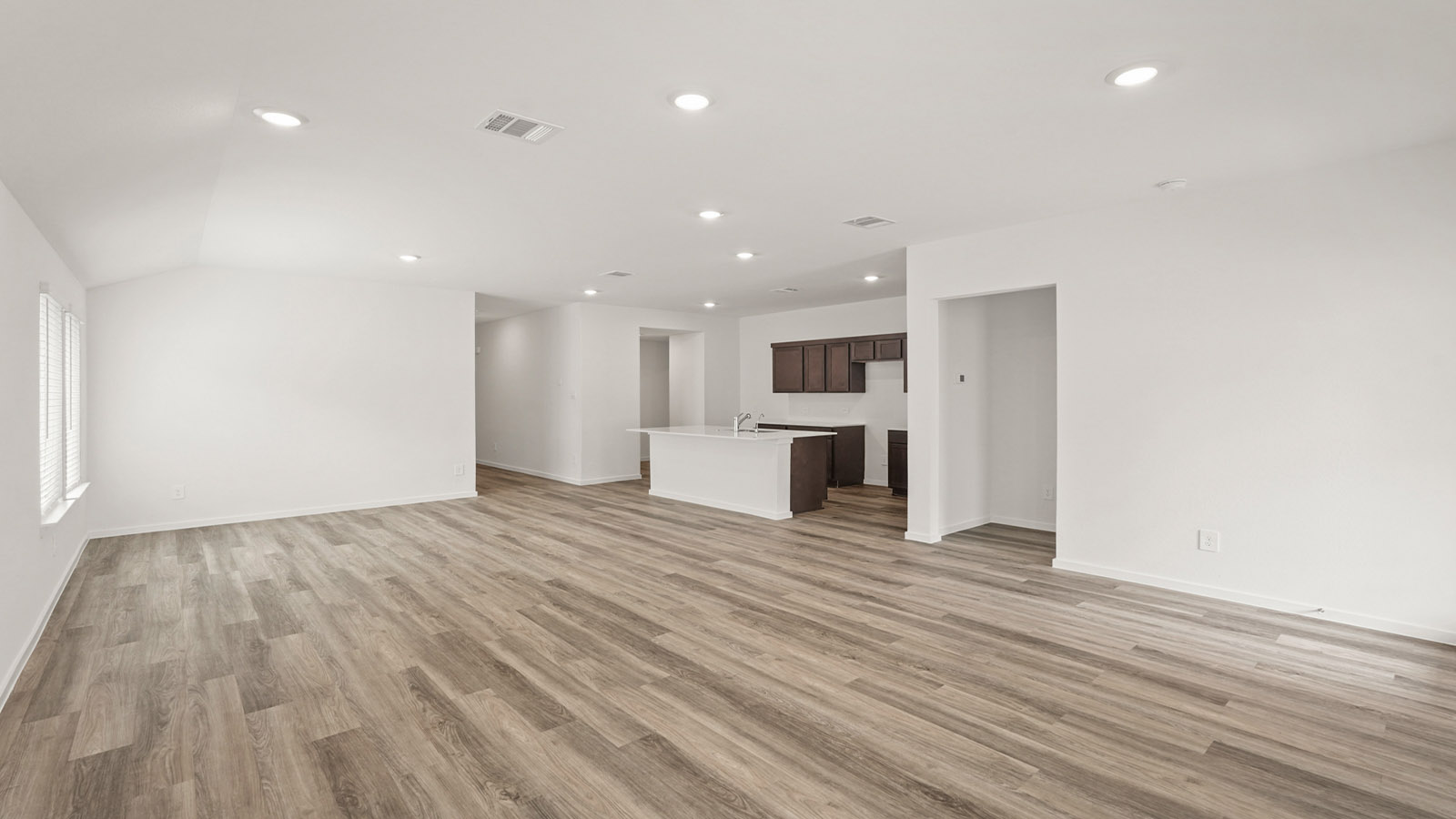 Open concept living, dining, and kitchen area