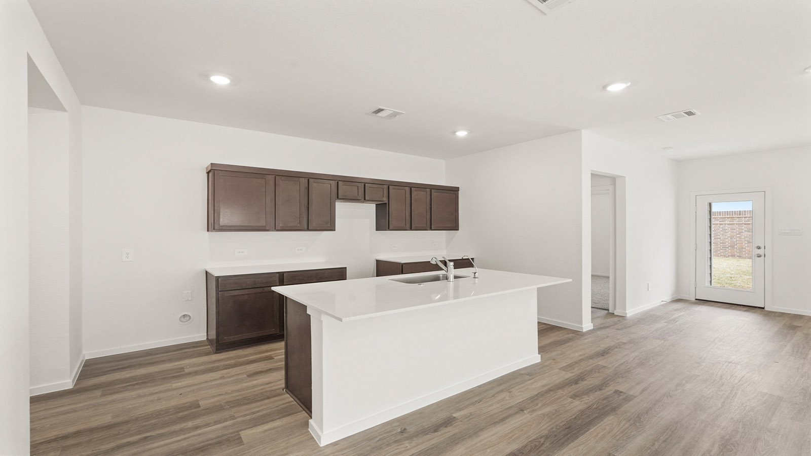 Open concept living, dining, and kitchen area