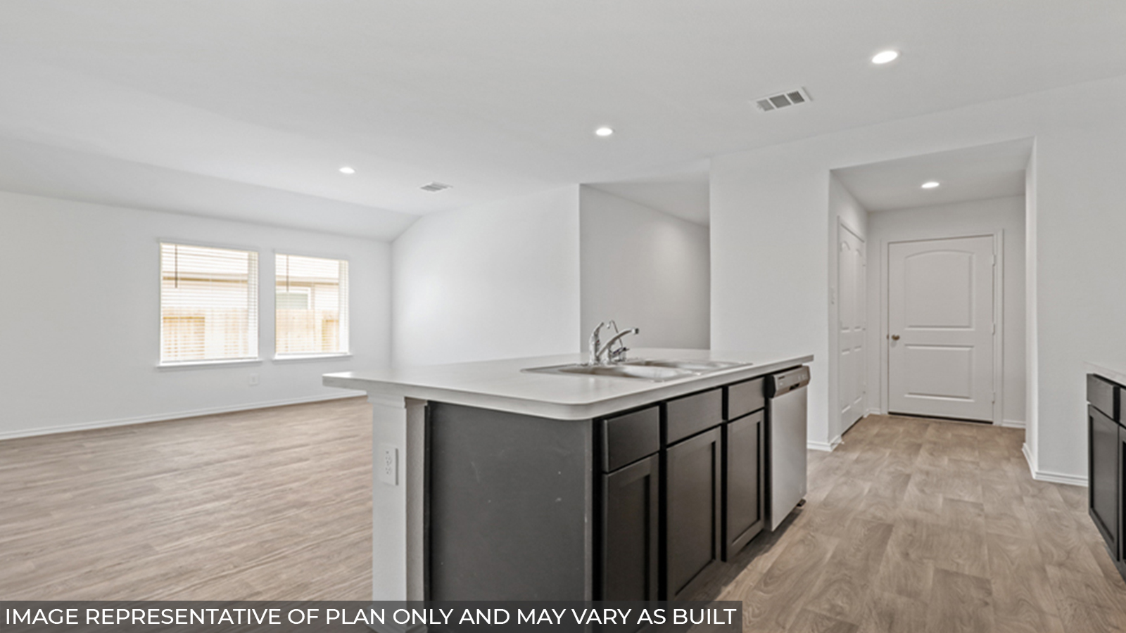 Kitchen with island and stainless-steel appliances.