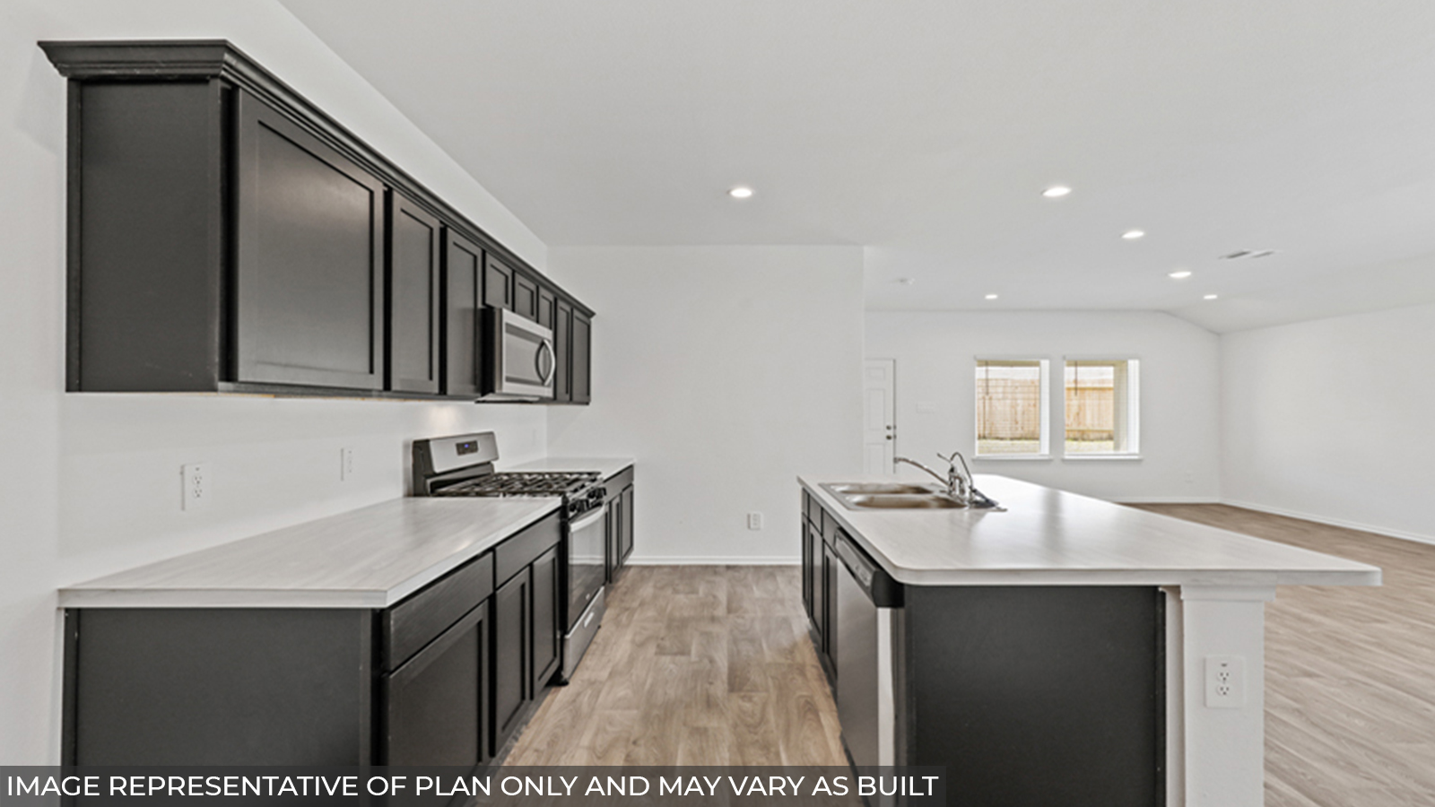 Kitchen with island and stainless-steel appliances.