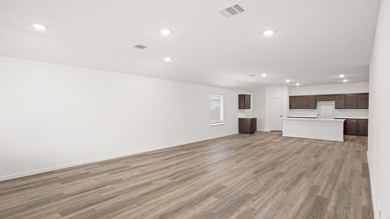 Open concept living, dining, and kitchen area