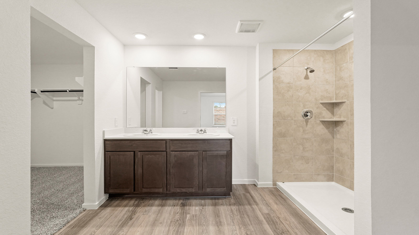 Primary bathroom with shower and linen storage