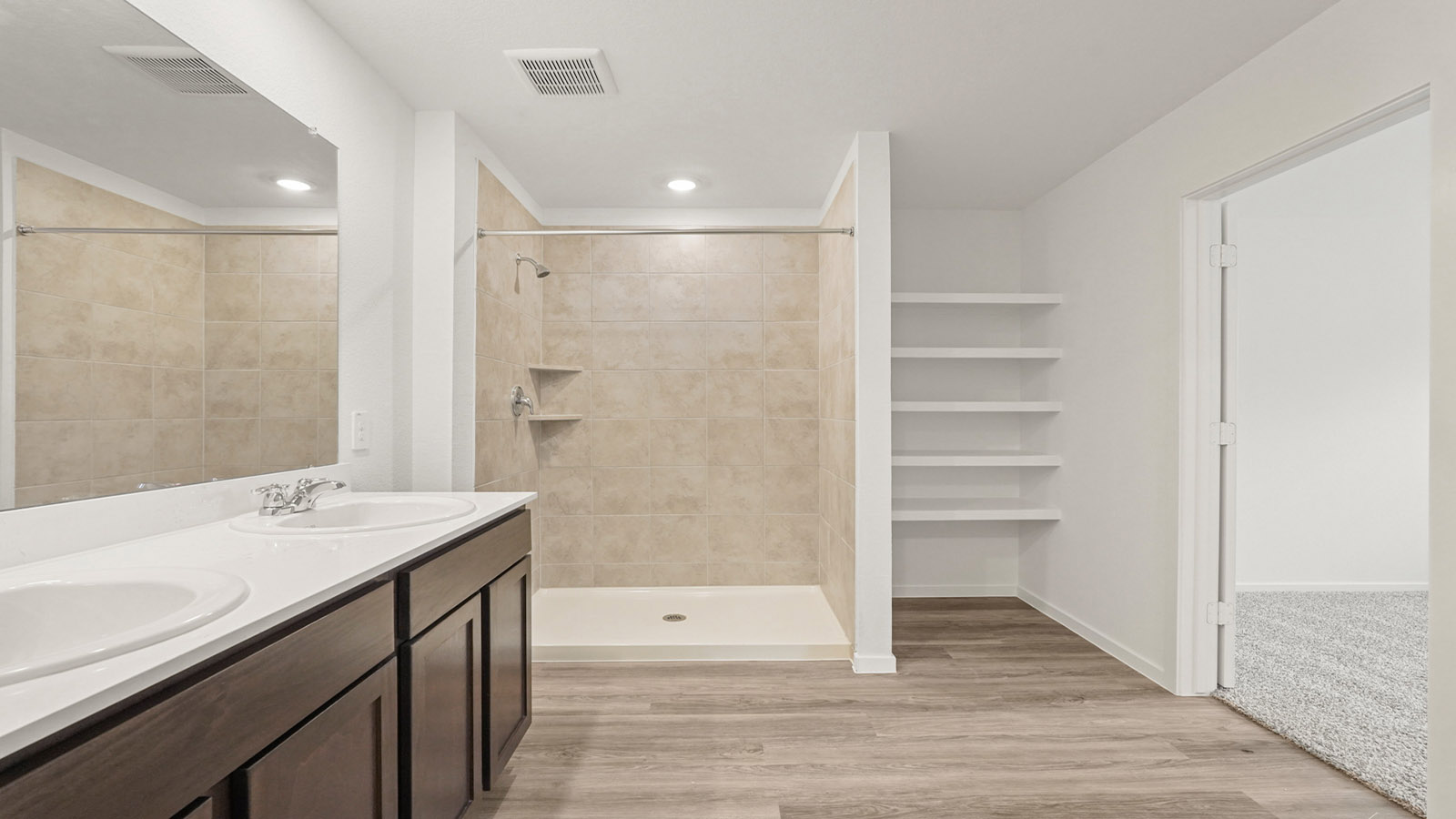 Primary bathroom with shower and linen storage