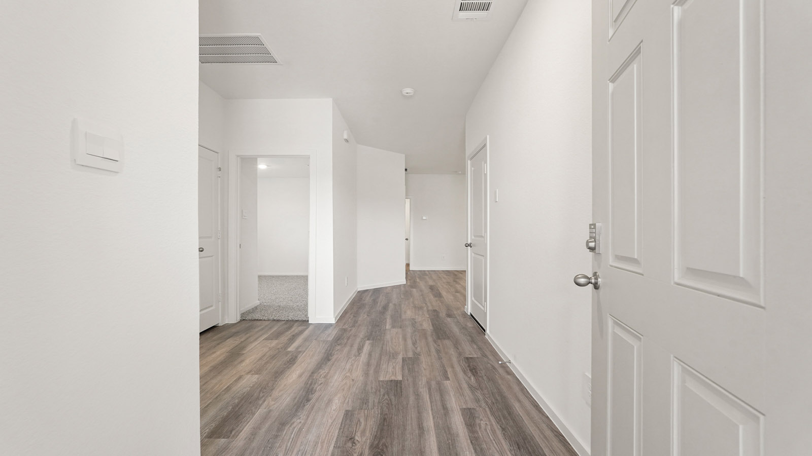 Entry hallway with vinyl flooring