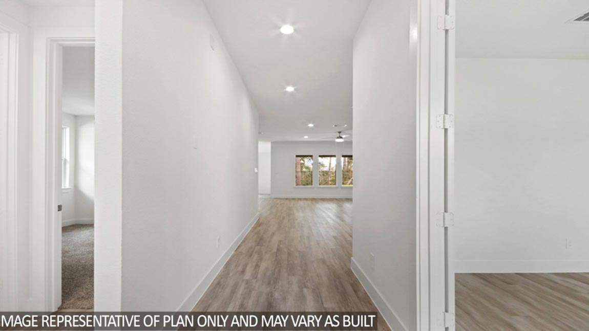 Entryway and foyer with vinyl flooring.