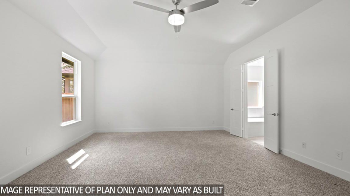 Primary bedroom with carpet flooring, a ceiling fan, and bright windows.