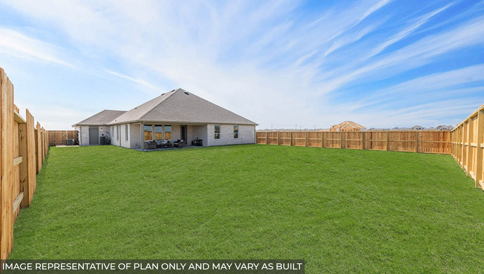 Spacious backyard with back patio and overhead light.