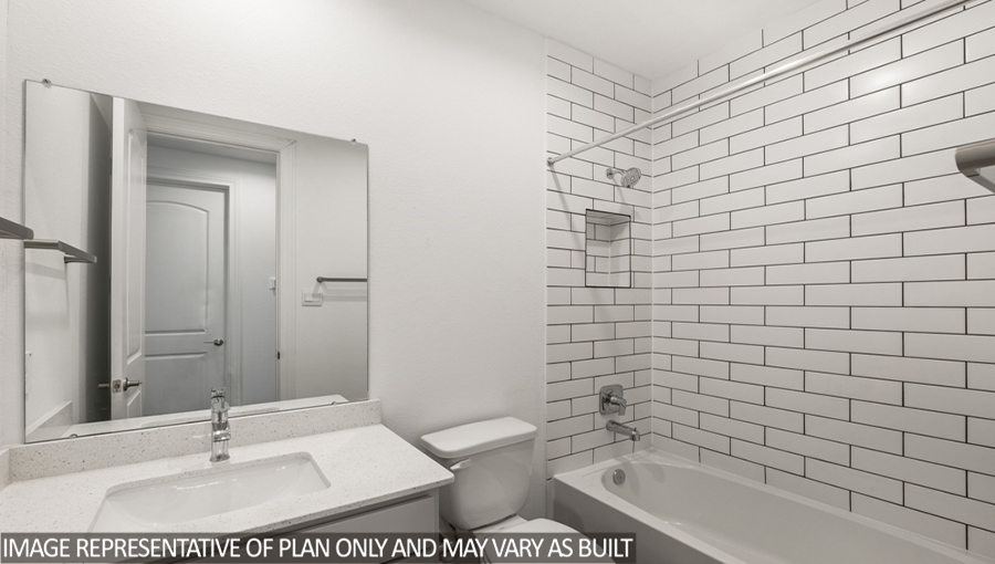 Secondary bathroom with a tile tub/shower combo.
