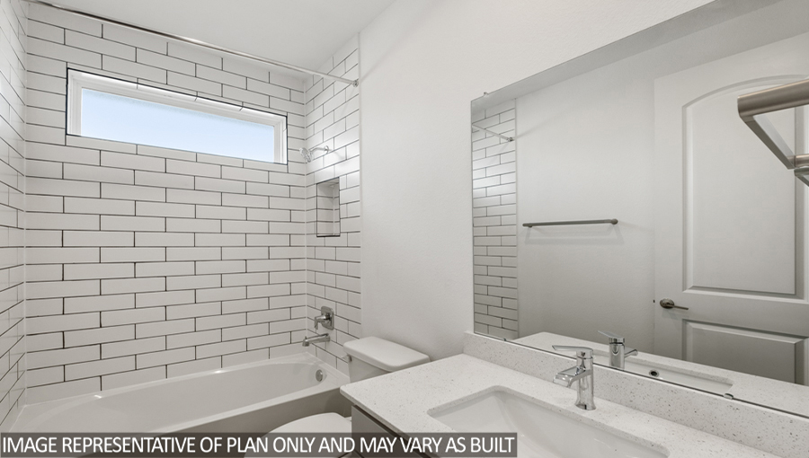 Secondary bathroom with a tile tub/shower combo.