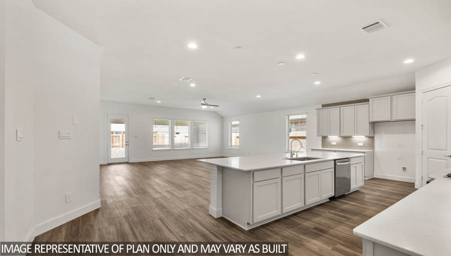Open concept living and dining space with vinyl flooring and bright windows.