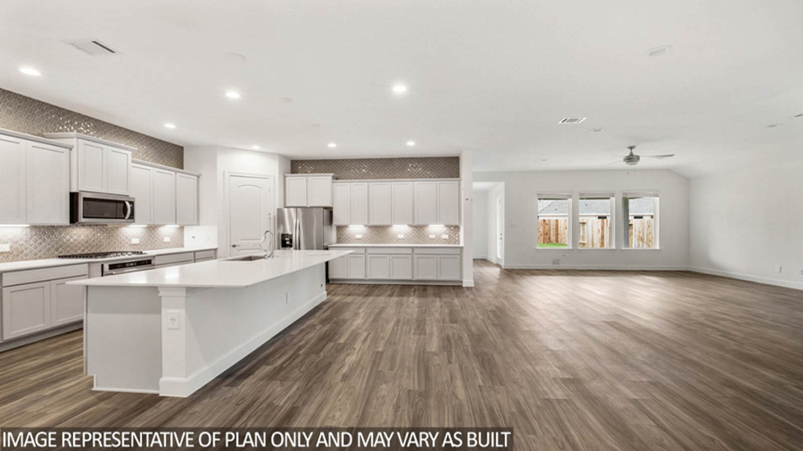 Open concept living, dining, and kitchen area