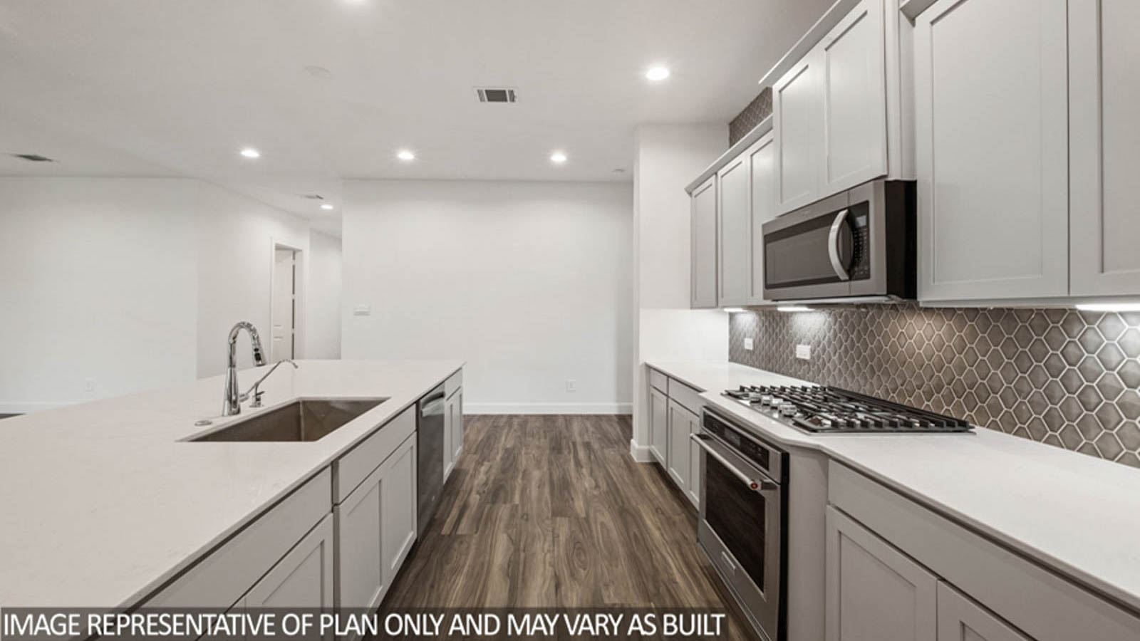 Kitchen with an island and stainless-steel appliances.