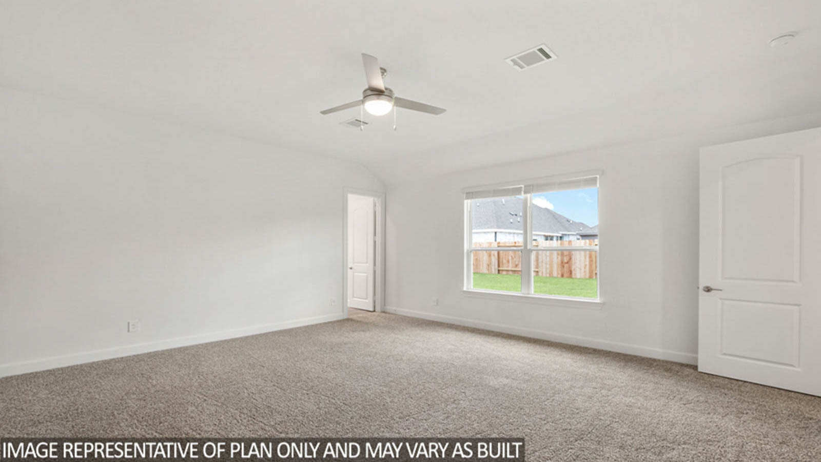 Primary bedroom with carpet flooring, a ceiling fan, and bright windows.