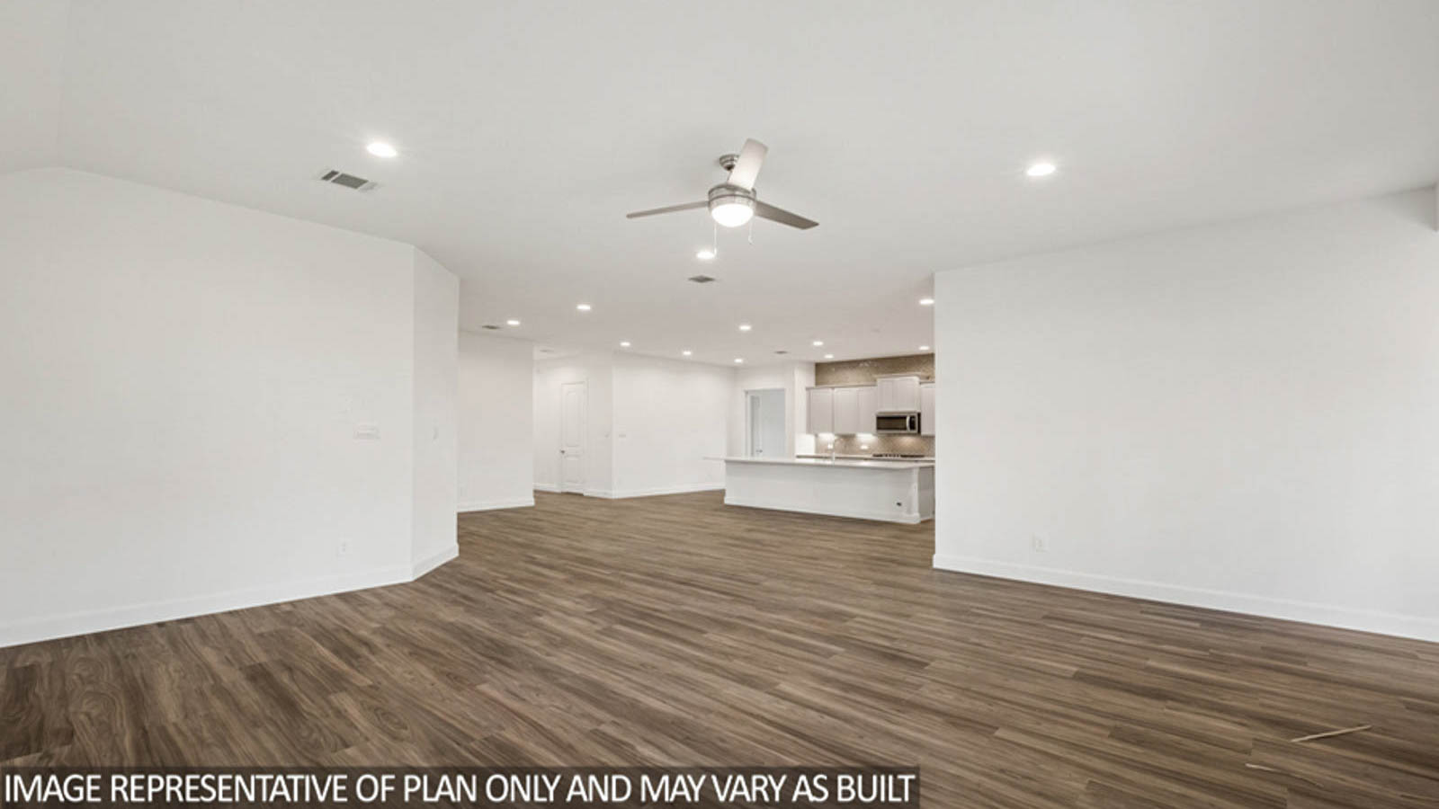 Open concept living and dining area with vinyl flooring and bright windows.