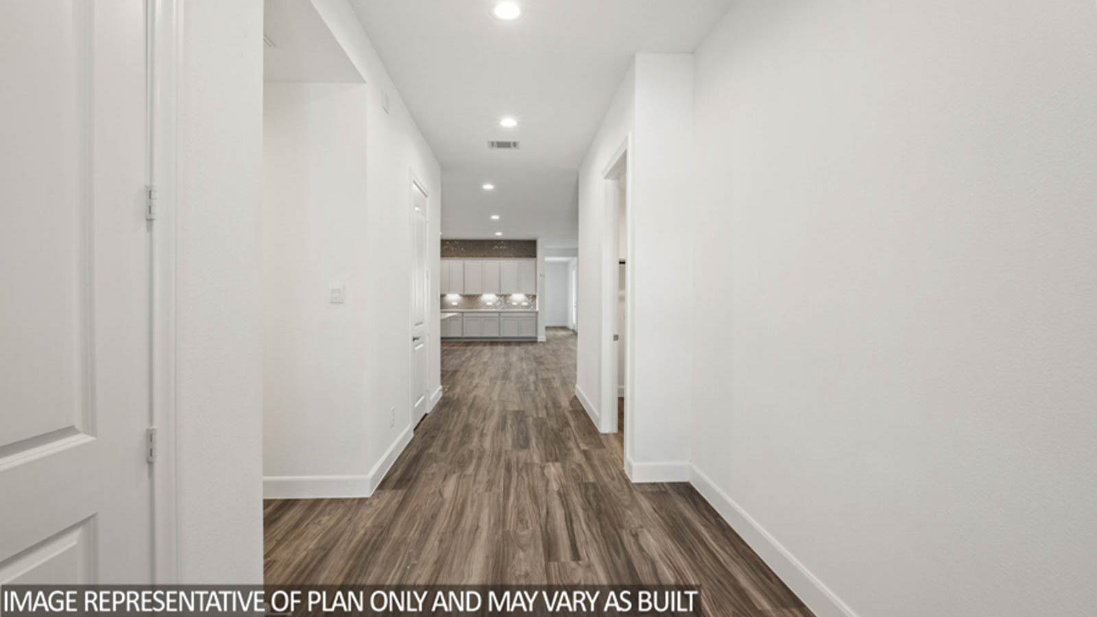 Entryway and foyer with vinyl flooring.