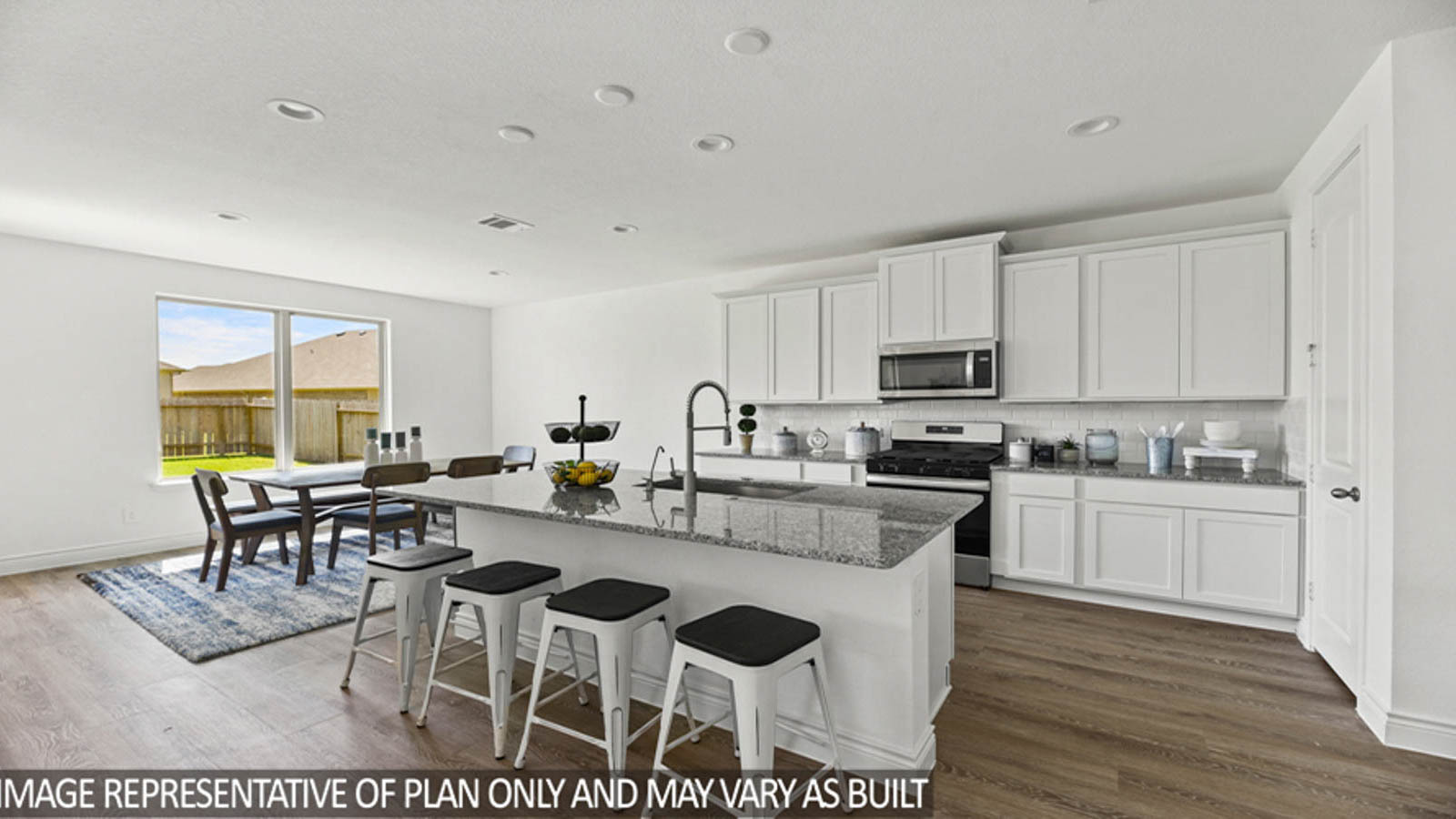 Open concept living, dining, and kitchen area