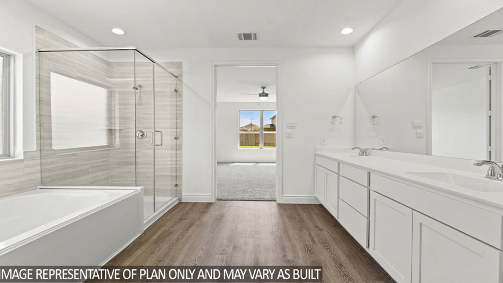 Primary bathroom with a separate toilet room and a walk-in closet.