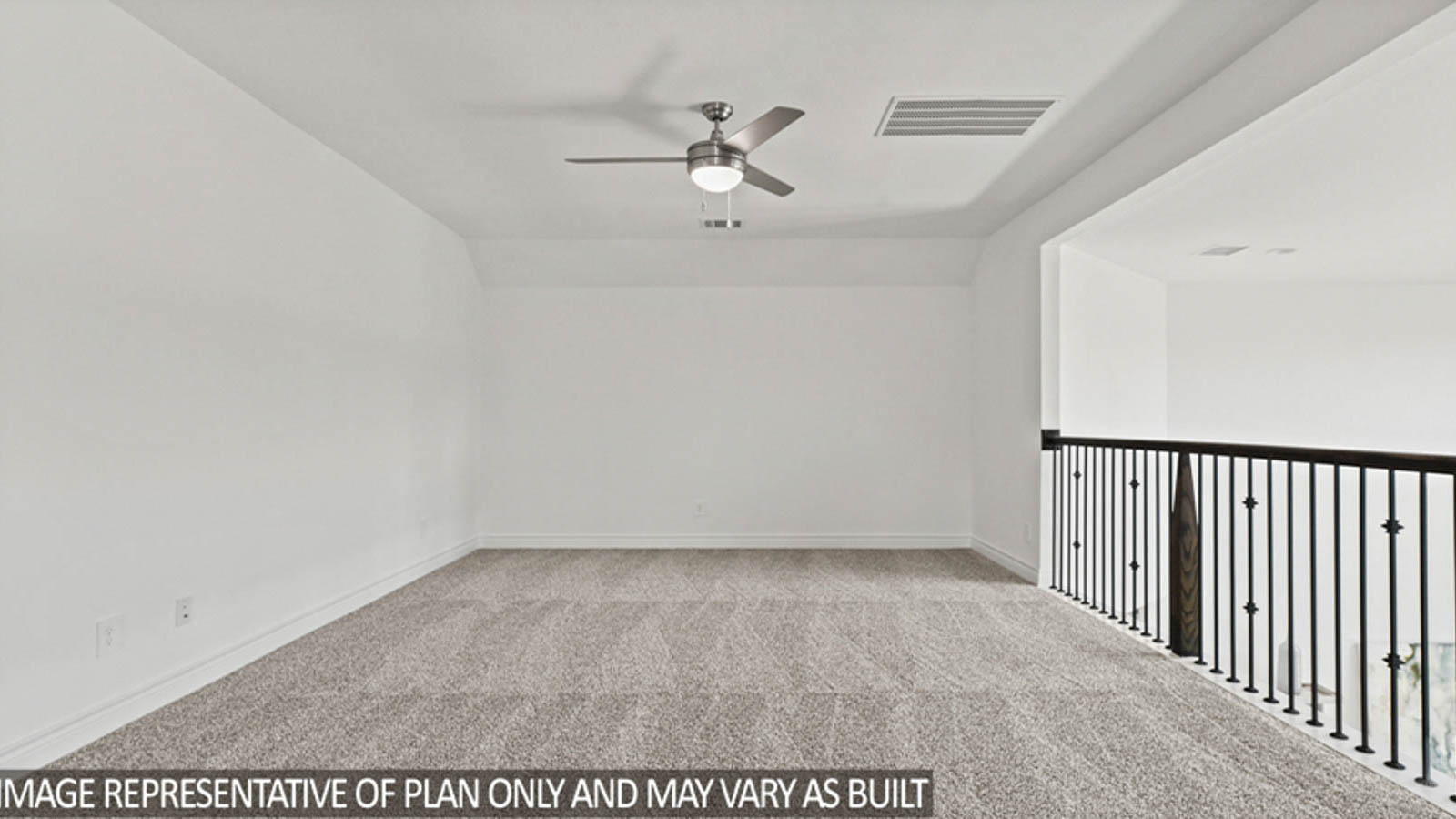 Upstairs loft with carpet flooring, a ceiling fan, and a balcony overlooking the first story of the home.