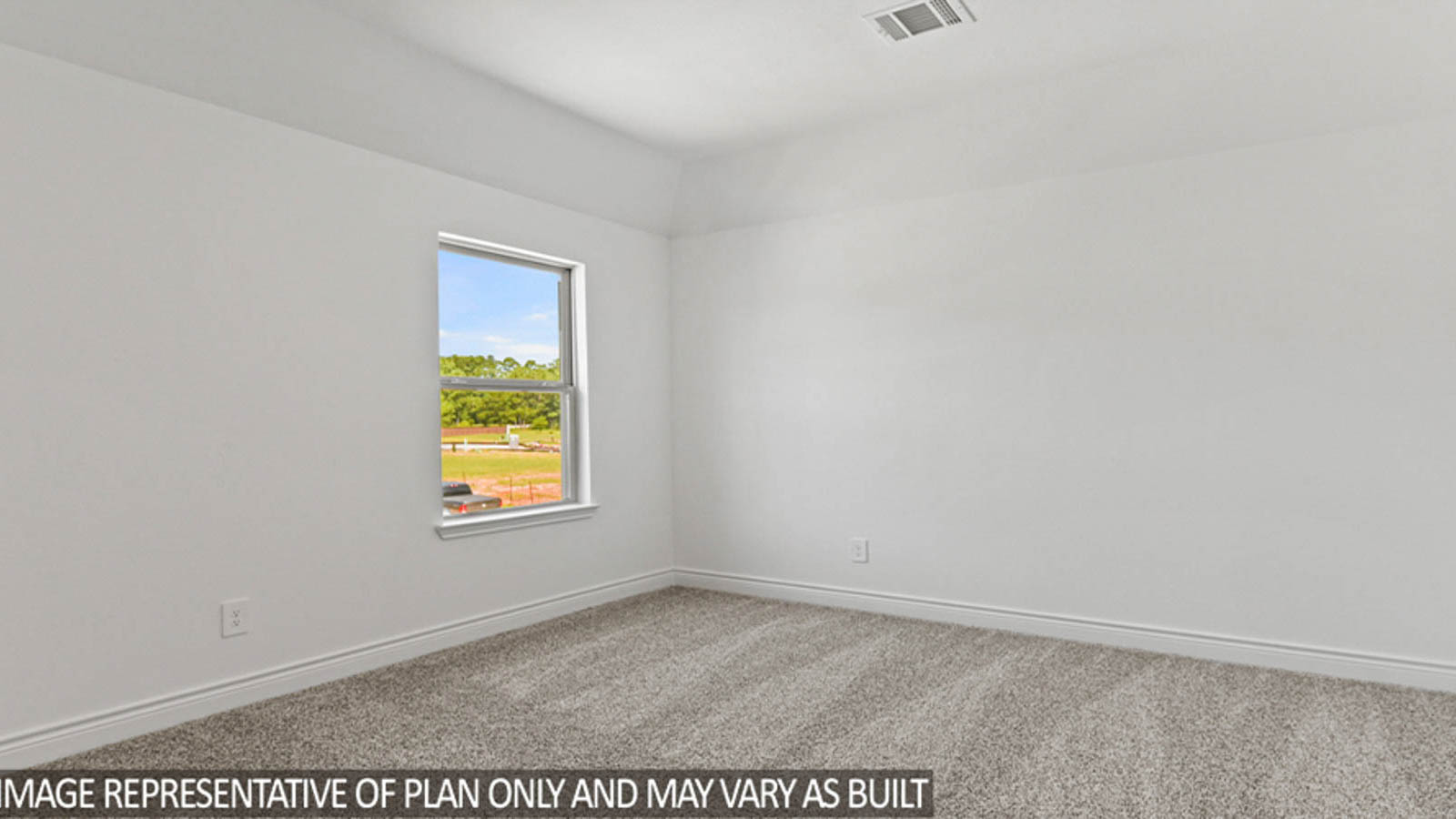 Secondary bedroom with carpet flooring and a bright window.