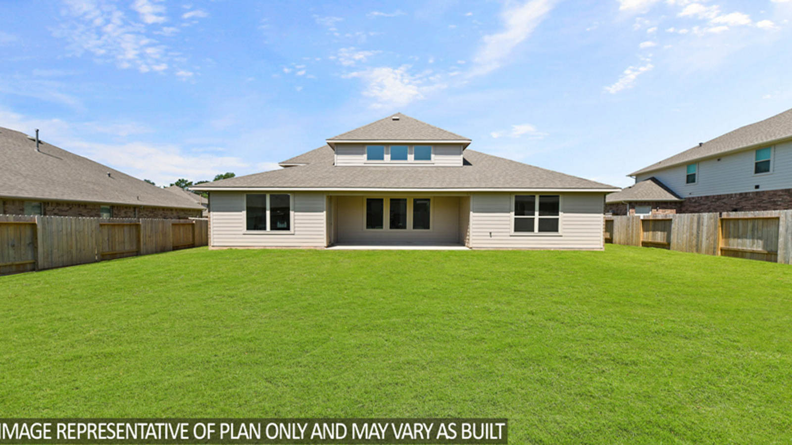 Spacious backyard with back patio and overhead lights.