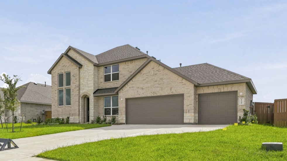 Two story home with three car garage
