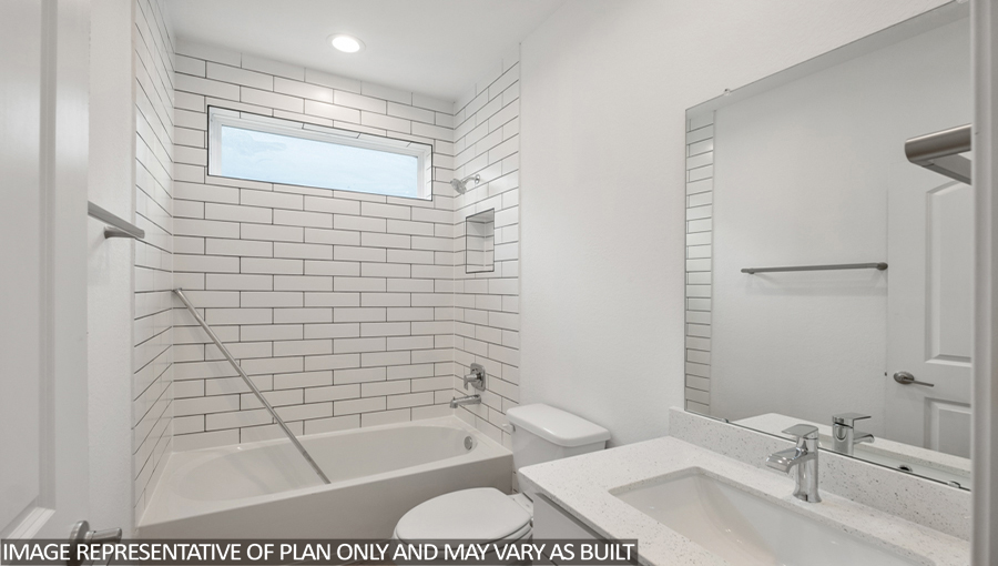 Secondary bathroom with vinyl flooring and a tile tub/shower combo.