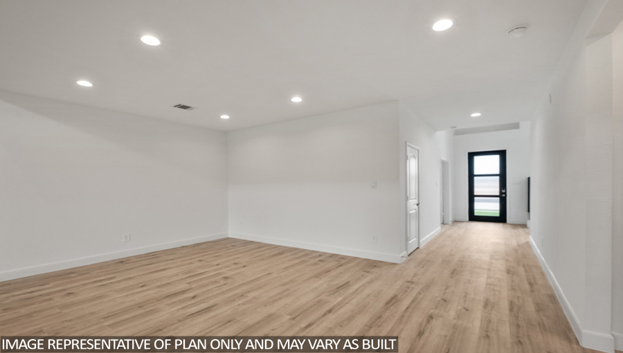Open concept living and dining area with vinyl flooring and bright windows.