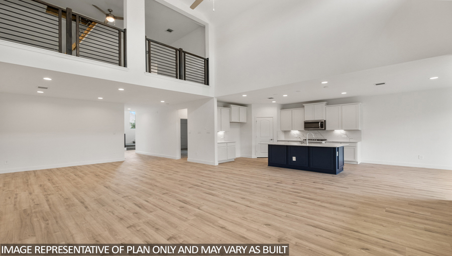Open concept living and dining area with vinyl flooring and bright windows.