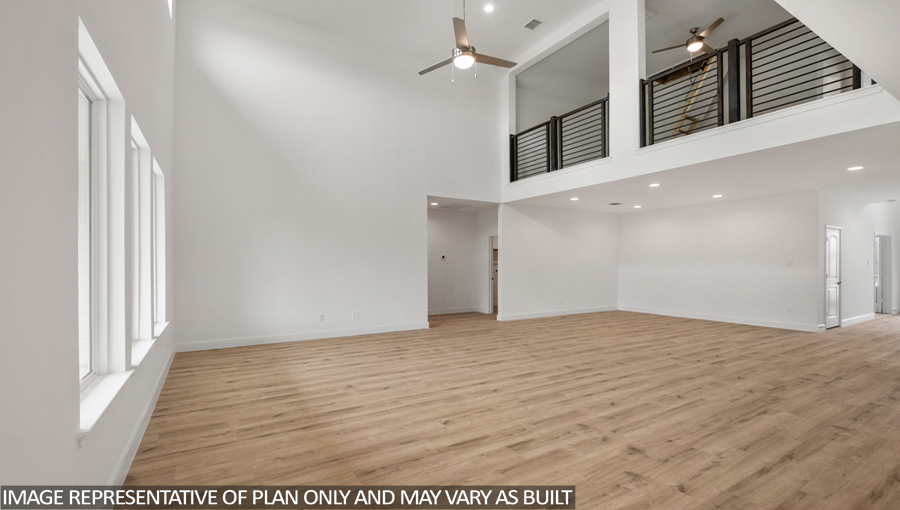 Open concept living and dining area with vinyl flooring and bright windows.