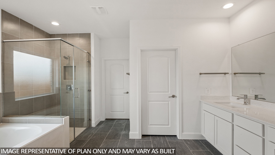 Primary bathroom with a separate toilet room and a walk-in closet.