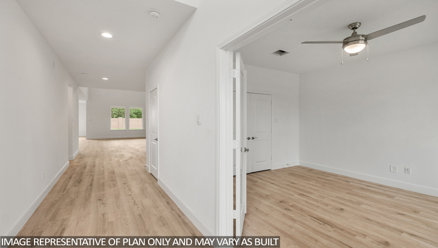Entryway and foyer with vinyl flooring.
