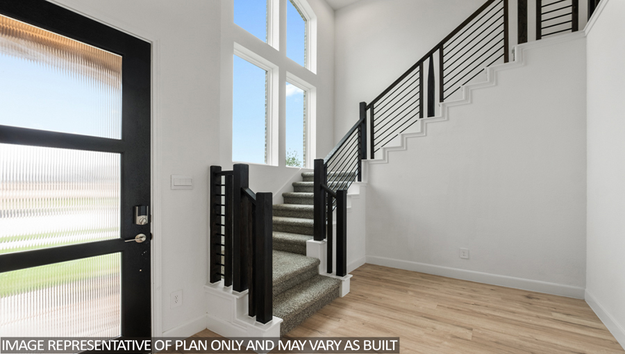 Entryway and foyer with vinyl flooring and bright windows.